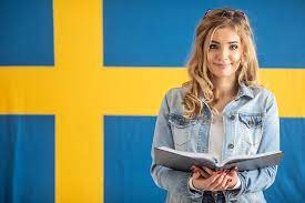 girl in front of Sweden flag